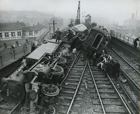 The aftermath of the Irk Valley Junction rail crash of 15 August 1953. The crash occurred at 7.40am when an electric train on route to Manchester from Bury collided with a steam train heading to Bacup. The crash claimed the lives of the driver of the electric train and nine of his passengers. The keen eyed might just spot a police officer on the left of the frame on the street below the scene but the Manchester City Police at the centre of the rescue and recovery operation. www.gmpmuseum.co.uk Railway Accidents, Amtrak Travel, Steam Trains Photography, Steam Trains Uk, Train Crash, Old Steam Train, Abandoned Train, Steam Railway, Railroad Photography