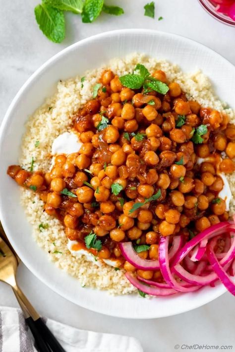 Delicious braised Harissa Chickpeas with Greek yogurt and pickled red onions. An easy vegetarian Mediterranean meal, ready in just 35 mins (including instruction to make on Stove Top or Instant Pot) Gluten free when served without couscous. That's the magic of home cooking! Recipe includes instructions to make Harissa Chickpeas in Instant Pot. #chickpeas #glutenfree #mediterranean #harissa #vegetarian #dinnerrecipe #healthydinner #harissachickpeas #couscous #pickledonion #instantpot Harissa Chickpeas, Chickpea Feta Salad, Spicy Feta, Easy Chickpea Curry, Chickpea Burgers, Basmati Rice Recipes, Vegan Chickpea Curry, Red Onion Recipes, Chickpeas Recipe