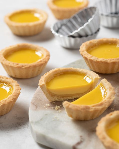 It’s National Egg Day, and we’re celebrating with a timeless treat: Egg Custard Tarts!  These beauties combine a buttery, melt-in-your-mouth crust with a glistening, vanilla-scented custard that’s rich and oh-so-satisfying.  Delicate yet decadent, they’re impossible to resist! These tarts are a staple in Chinese bakeries for a reason, and they're perfect for any occasion. Custard Tartlets, Egg Custard Tarts, National Egg Day, Egg Tart Recipe, Custard Tarts, Baking School, Afternoon Tea Recipes, Recipes From Around The World, Egg Custard