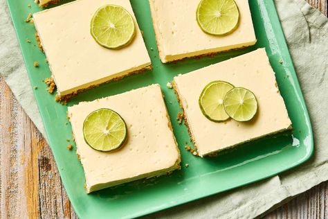 Key Lime Pie Cheesecake Bars Are “Creamy, Tart and Tangy” Lime Cheesecake Bars, Key Lime Cheesecake Bars, Key Lime Pie Cheesecake, Chocolate Graham Cracker Crust, Key Lime Pie Bars, White Chocolate Shavings, Key Lime Cheesecake, Pie Cheesecake, Cheesecake Bar Recipes