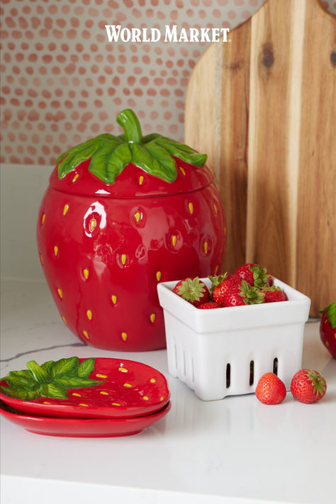 Bring sweet, garden-inspired character to the kitchen with our exclusive strawberry-shaped cookie jar. Made of stoneware, this sweet berry treat container is hand-painted in bright red with a green stem atop its lid. Airtight to preserve all your baked treats, this gift-worthy goodie jar adds whimsy and charm to the counter. #WorldMarket Strawberry Cookie Jar, Ceramic Strawberry, Strawberry Cookie, Baked Treats, Hand Painted Ceramic, World Market, Cookie Jar, Bright Red, Food Storage