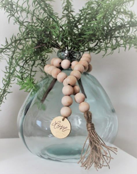 Come take a look at all the different ways you can style wood bead garland. Wood bead garland is the perfect accessory to add farmhouse charm. Bead Tassels, Beauty For Ashes, Wood Beads Diy, Wooden Bead Garland, Bead Garland, Wood Bead Garland, Farmhouse Charm, Beaded Garland, Diy Beads