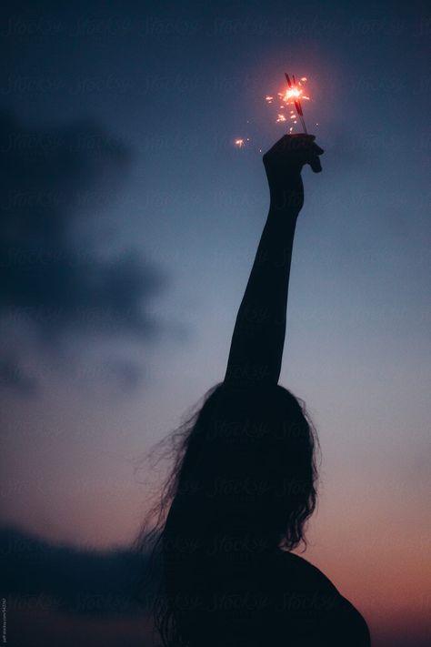 Silhouette Of A Young Woman Holding Up High A Sparkler At Night | Stocksy United Sparkler Photography, New Year Photoshoot, Fireworks Photo, Fireworks Photography, Diwali Pictures, Blue Woman, Birthday Background Images, Flower Photoshoot, Silhouette Photography