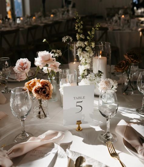 The dreamiest of bud vase centerpieces 😍 I can't get over the magic that @medaabigailphotography made with this table and that lighting. ✨ It just needed a permanent place on our feed. Bud Vases And Taper Candles Centerpiece, All White Bud Vases Wedding, Candles And Roses Centerpieces, Bud Vases Circle Table Wedding, Round Table Bud Vase Centerpiece, Wedding Bud Vases Centerpiece, Round Table Candle Centerpieces, Round Table Wedding Set Up, Bud Vase Centerpiece Round Table