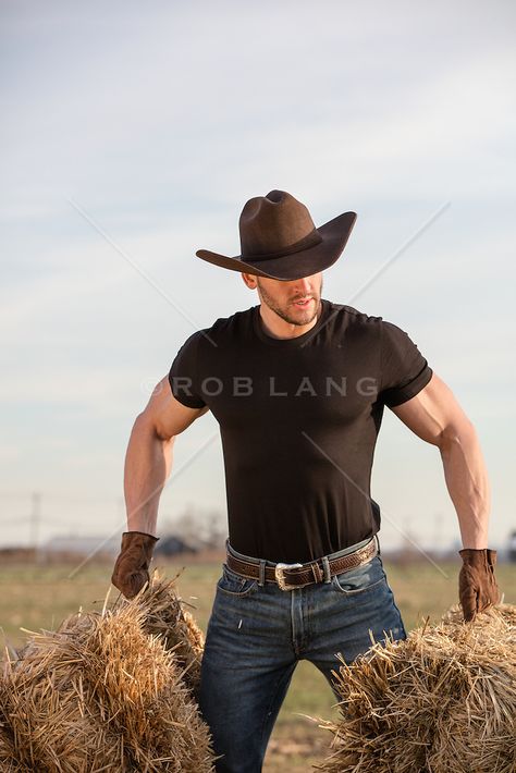 rugged muscular cowboy lifting hay bales on a ranch | ROB LANG IMAGES: LICENSING AND COMMISSIONS Black Cowboy Hat Outfit Men, Cowboy Hat Outfit Men, Cowboy Outfit For Men, Bales Of Hay, Cowboy Chaps, Farmer Outfit, Handsome Cowboys, Black Cowboy Hat, Cowboys Men