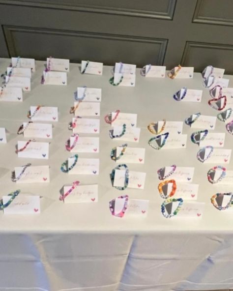 For my wedding of 120 guests, I made a friendship bracelet with each guest’s name and used bead colors unique to each person. We put each bracelet with the name card. I also made bracelets for the tables as decor, and put things like song lyrics, swiftie things, inside jokes, child names, or pet names at tables based on the seating chart. I did this as a Swiftie but was pleasantly surprised at how much all guests loved the bracelets- non-swifties included! I had so much fun making these brace... Wedding Friendship Bracelet, Child Names, Made Bracelets, Name Card, Inside Jokes, Seating Chart, Seating Charts, Name Cards, My Wedding