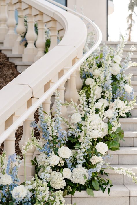 White rose, white hydrangea, white snapdragons, white spray rose, blue delphinium floral hedge staircase floral Hydrangea Staircase Wedding, White Roses And Blue Hydrangeas Centerpiece, White Hydrangeas Centerpiece, Pastel Blue Wedding Flowers, Wedding Flowers Staircase, White Floral Design, White Flowers With Blue Accents, Hydrangea Wedding Arrangements, Blue And White Floral Arch