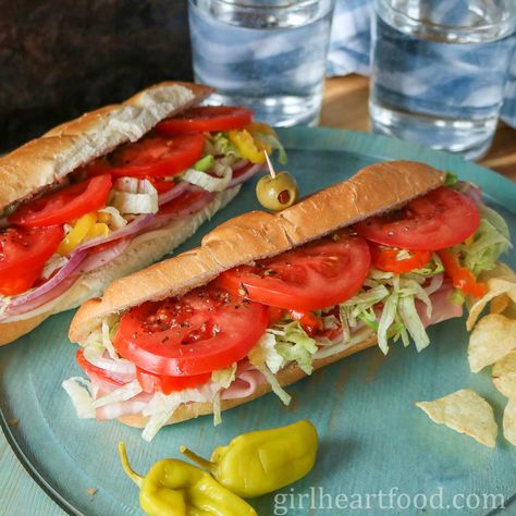 Make a sub shop favourite with this easy cold cut sub recipe! There's provolone cheese, plenty of Italian cold cuts & veggies. So yummy! Italian Cold Cut Sandwich, Cold Cut Sandwich, Pickled Olives, Sandwhich Recipes, Easy Cold, Cut Recipe, Best Sandwich Recipes, Hoagie Rolls, Cold Cuts