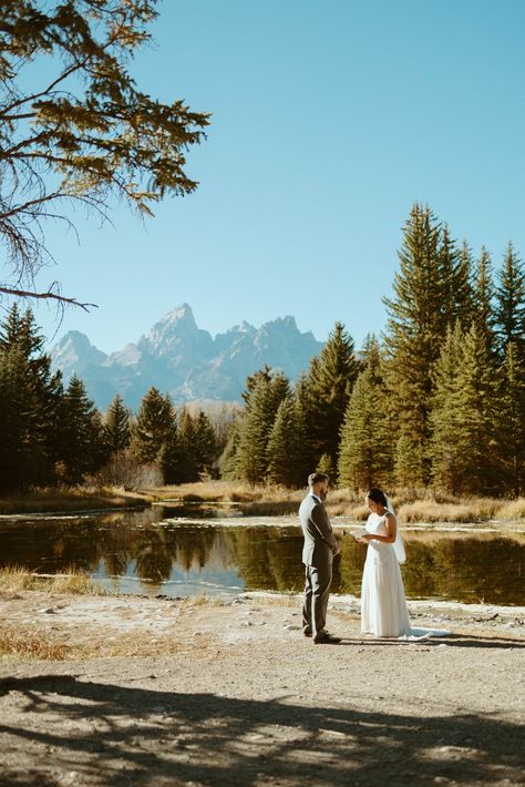 couple-reading-vows-at-schwabachers-landing-in-teton-national-park Couple Reading, National Park Wedding, Mountain Elopement, Elopement Wedding, Park Weddings, Jackson Hole, Elopement Inspiration, Elope Wedding, Elopement Photography