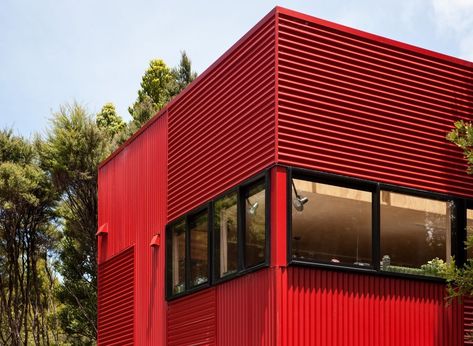 While the form appears familiar, in both shape and materiality, the directional display of corrugated iron sheeting subtly creates movement in the façade, allowing light to interact with the surface in differing ways throughout the day. #homedesign #corrugagediron #metalsheeting #homedesign #modernhomes #containerhouses #dreamhome #homeinspo #homedesignideas #exterior Metal Building Designs, Corrugated Iron, Container Design, Exterior Cladding, Building Systems, Red House, Curated Design, River Valley, Metal Buildings