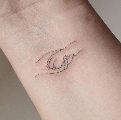 Small Tattoo Ideas For Dog Lovers, Hand Holding Paw Tattoo, Animal Welfare Tattoo, Fine Line Labrador Tattoo, Paw In Hand Tattoo, Dog Tattoo Fine Line, Meaningful Dog Tattoos, Dainty Dog Tattoos, Paris Tattoo Ideas