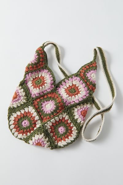 Casual crochet shoulder bag rendered in an open design with a long shoulder strap. Due to its handmade design, there may be slight variations from pictured. Content + Care. 100% Cotton Machine wash Imported Size. Length: 13” Width: 10” Height: 20” Strap drop: 20” Granny Square Crossbody Bag, Floral Crochet Pattern, Crochet Small Bag, Square Crossbody Bag, Urban Outfitters Bags, Urban Outfitters Bag, Crochet Shoulder Bag, Crochet Handbags Patterns, Crochet Granny Square