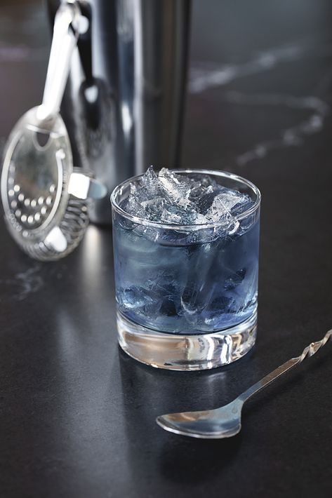 Blue Tuxedo  Not only delicious but eye-catching too, the Blue Tuxedo is made to be featured at a luxury event.  1.5 oz Bacardi White Rum 1 oz Blue Curaçao .5 oz Cranberry Juice Pour ingredients into a shaker filled with ice, stir with a spoon, then strain over ice in a rocks glass. Wedding Cake Martini, Signature Cocktail Ideas, Bacardi White Rum, Luxury Vodka, Patron Silver Tequila, Spring Flavors, Patron Silver, Malibu Coconut, Blue Tuxedo