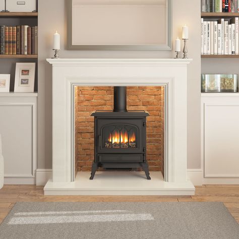 The Odella micro marble inglenook surround is beautifully complimented by a gas or electric stove at its centre. Available in Manila, Grey or White. Faux Fireplace With Electric Wood Stove, Wood Stove In Fireplace, Wood Burner Fireplace, Wood Burning Stoves Living Room, Log Burner Fireplace, Log Burner Living Room, Limestone Fireplace, White Fireplace, Living Room Decor Fireplace