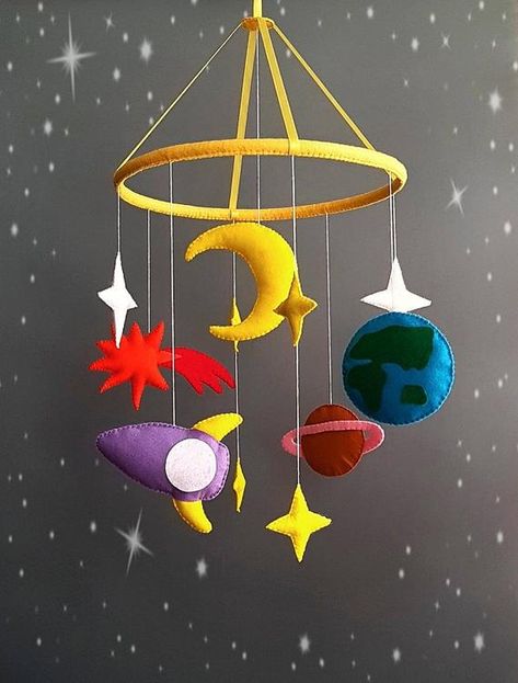 Space baby mobile.Beautiful space and galaxy style. Mobile cot for the baby with the elements of the solar system.Colorful and bright colors of stars,moon,planets and a rocket.All items are of high quality felt.Ring plastic covered with felt.Satin ribbons hold the ring.The top loop. In the photo Crib Mobile Boy, Hanging Crib Mobile, Space Mobile, Hanging Crib, Mobile Girl, Boy Mobile, Mobile Hanging, Baby Mobil, Baby Boy Mobile