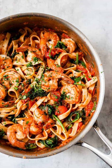 Healthy and easy tomato prawn pasta is the perfect 30-minute dinner. Simple fresh tomato sauce made with lots of garlic and tender juicy prawns is a one-pot dinner that comes together in 30 minutes. All the ingredients are from Aldi and the recipe has step by step photos so it comes out perfect every time! #easyrecipe #pasta #seafood #aldirecipe Prawns Dinner Recipes, Seafood Pasta Healthy, One Pot Seafood Pasta, Prawn Dinner Ideas, Dinner Ideas Prawns, Fish Pasta Dinner Recipes, Prawns In Tomato Sauce, Prawn And Tomato Pasta, Prawns Recipe Healthy