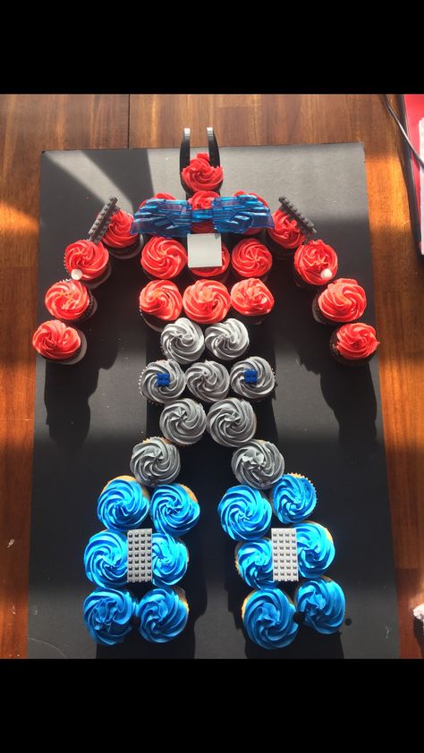 Optimus Prime Cupcakes Transformers birthday Transformers Birthday Cake Ideas, Transformers Birthday Cupcake Cake, Trans4mer Birthday Ideas, Transformers Birthday Cake Diy, Cheap Birthday Food Ideas, Transformers Theme Party, Transformers Birthday Cupcakes, Transformers Bday Party Ideas, Transformers Themed Food