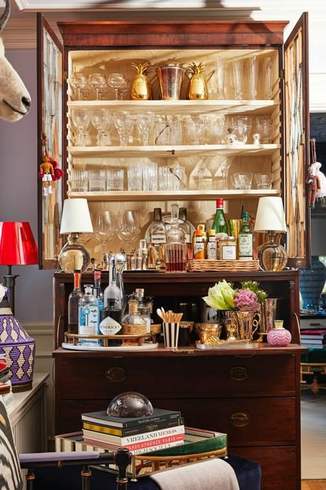 Is Brown Furniture Back? Yes! Here’s How to Style It #purewow #home #home picks #decor Bar Set Up Ideas For Home, Anthro Store Display, Styled Bar Cabinet, Vintage Bar Set Up, Drinks Cabinet Ideas Home Bars, Eclectic Home Bar, Bar Cabinet Styling, Bar Tray Styling, Bar Cabinetry