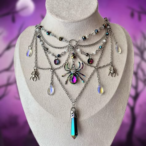 This captivating necklace features multiple layers of chains and beaded strands, adorned with iridescent glass charms and spiders. At its center, an iridescent spider pendant and a tourmaline hexagon pendant add a mesmerizing focal point, perfect for those who love unique and enchanting accessories. Necklace full length is 38 cm (14.96 inch) **IMPORTANT NOTICE If you need a longer length, please send me your measurements to ensure your necklace fits properly. All sales are final. Thank you 💗 Diy Chain Necklace, Handmade Mystical Purple Necklace, Gothic Handmade Adjustable Beaded Necklaces, Gothic Bead Necklace, Handmade Necklace Tutorial, Spider Necklace Aesthetic, Beaded Spider Web Necklace, Purple Choker, Diy Chain