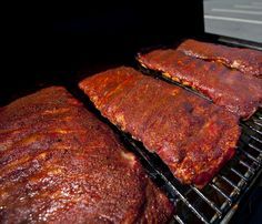 How Long to Cook Ribs on the Grill?. Although grilling aficionados can wax lyrical about meat falling of the bone, a properly cooked rib should still have a little purchase where the two join. Above all, ribs cannot be rushed on the grill. Slow grilling on a moderate heat allows the fats to render and the meat to absorb smoky flavors. If smoking... Cooking Ribs On Grill, Easy Pork Ribs, Grill Ribs, Grill Nation, Cooking Ribs, Smoked Pork Ribs, Bbq Recipes Ribs, How To Cook Ribs, Bbq Dishes