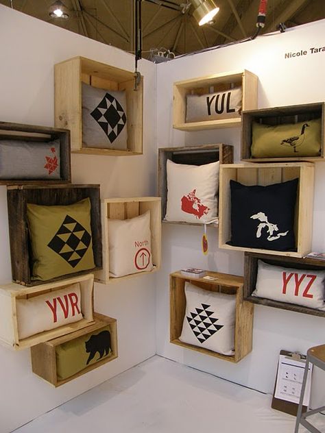 Attach old crates to the wall to use to display them. This would work for any item that fit in the boxes. If needed, attach a bit of wire mesh (chicken wire?) across the bottom of the crate opening to keep the items from falling out. Purse Display, Old Crates, Shop Displays, Jewellery Showroom, Shop Fittings, Craft Show Displays, Shop Decor, Merchandising Displays, Store Displays