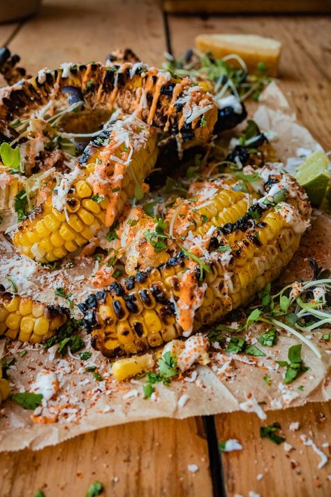 Elote style grilled corn ribs served with Mexican crema, spicy aioli, chopped cilantro, tajin and parmesan cheese. Elote Corn Ribs, Mexican Corn Ribs, Corn Ribs Recipe, Bbq Spread, Corn Ribs, Grilled Kabob Recipes, Vegetarian Ideas, Spicy Aioli, Grilling Kabobs