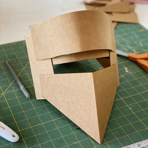 Cardboard Helmets — Hollowed Earth Pottery Cardboard Helmet Diy, Cardboard Helmet Template, Cardboard Knight Helmet, Cardboard Halloween Costumes, Helmet Out Of Cardboard, Paper Helmet, Cardboard Armor, Cardboard Helmet, Gladiator Party