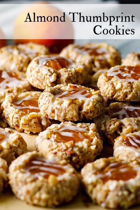 These almond thumbprint cookies are melt-in-your-mouth tender and positively addicting. #thumbprintcookies #jam #jamcookies #shortbread #cookies | ofbatteranddough.com Colossal Cookies, Shortbread Thumbprint Cookies, Almond Thumbprint Cookies, Cookies Shortbread, Almond Glaze, Almond Shortbread, Cookie Recipes From Scratch, Oatmeal Raisin Cookies Chewy, Dessert Cookies