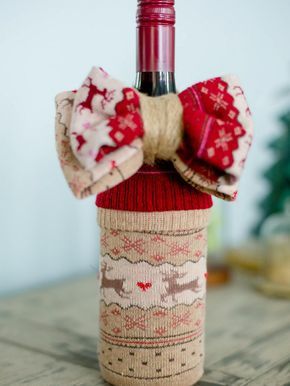 The entertaining experts at HGTV.com share 10 creative ways to wrap a wine bottle gift for the holidays. Wrap A Wine Bottle Gift, Wrap A Wine Bottle, Christmas Socks Exchange, Wine Bottles Gift Wrap, Bottle Gift Wrapping, Wine Wrap, Wine Bottle Crafts Christmas, Wrapped Wine Bottles