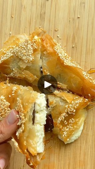 25K views · 249 reactions | Baked Feta in Phyllo | This Baked Feta Phyllo is such a fun appetizer idea. You only need feta, phyllo pastry, butter or ghee to make it but I’m taking it up a notch by adding... | By Feel Good Foodie | This is baked feta filo and I'm
obsessed. It's basically a block of feta cheese wrapped up
in buttery flaky layers of filo sheets. Now I like to combine
that salty feta cheese flavor with calmata olives but you can
add anything else inside like peppers or sun dried tomatoes.
Wrap up the olives and feta with the filo. Sprinkle with
some sesame seeds and then bake at 375 for 15 minutes. Drizzle
it with honey on top and then you can slice it however you
want and enjoy it with a fork or by hand. So good. Feel Good Foodie, Phyllo Pastry, Baked Feta, Cheese Wrap, Cheese Flavor, Sun Dried Tomatoes, Best Appetizers, Dried Tomatoes, Sun Dried