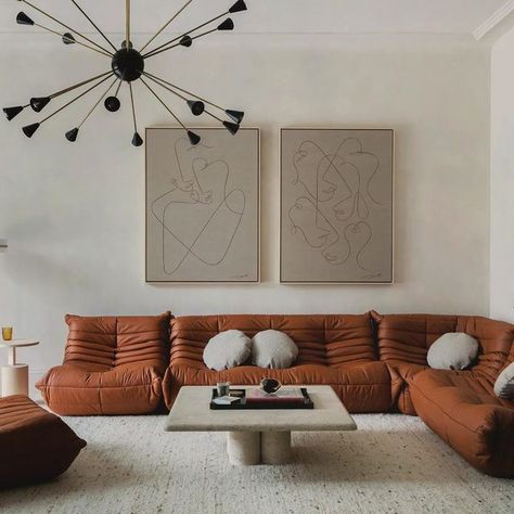 STUDIO DUGGAN on Instagram: "A family room from a recent project 🤎 We introduced lots of texture with the @coralandhive mohair rug, bespoke terrazzo floors and @bauwerkcolour lime wash walls in order to create a calming neutral space with both interest and warmth. The vintage Sputnik adds a little drama. In person it really has the most chilled vibe. The vintage Togo sofa is relatively indestructible too! 😆 Brought to life by the specially commissioned @jessicayolandakaye artwork which depicts Arts And Crafts Tiles, Limewash Paint, Togo Sofa, Sofa Colors, North London, London Design, Reception Rooms, Decorating Coffee Tables, Upholstered Headboard