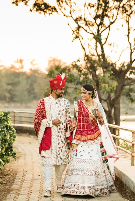 Photo of Twinning matching bride and groom in white and red Bride And Groom In White, Indian Wedding Outfit Bride, Matching Bride And Groom, Groom In White, Gujarati Wedding, Designer Bridal Lehenga Choli, Indian Wedding Photography Couples, Couple Wedding Dress, Wedding Lehenga Designs