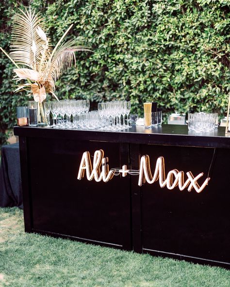 Customize your cocktail hour by hanging a neon sign (this one is by Echo Neon) that features your names on the front of your wedding bar. #Wedding #WeddingSigns #NeonSign #WeddingIdeas #Unique #Modern #WeddingTrends | Martha Stewart Weddings - 20 Ways to Use Neon Signs to Light Up Your Wedding Spring Wedding Cocktails, Wedding Cocktail Bar, Wedding Themes Spring, Parker Palm Springs, Rustic Wedding Decorations, Cocktail Hour Wedding, Reception Signs, Palm Springs Wedding, Bar Set Up