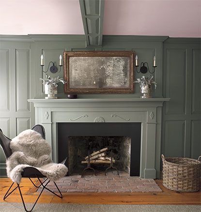 A green-painted living room with matching green mantel and fur throw. Green Wall Paint, Sage Green Living Room, Light Green Paint, Half Painted Walls, Green Painted Walls, Green Accent Walls, Dark Green Walls, Popular Paint Colors, Favorite Paint Colors