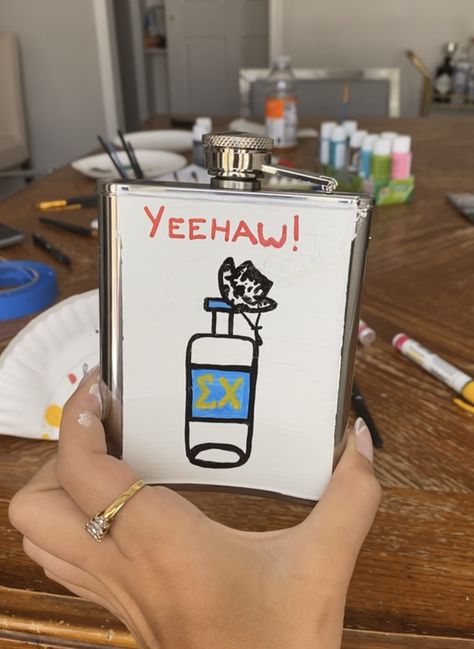 Yeehaw. Cowboy hat. Alcohol. Tito’s. Country flask. Cowboy flask. Fraternity formal. Sigma chi. Painted Flask Ideas, Fraternity Flask Painted, Painted Flask Fraternity, Decorated Flask, Flask Ideas Diy, Formal Flask, Flask Painting, Fraternity Flask, Painted Flask