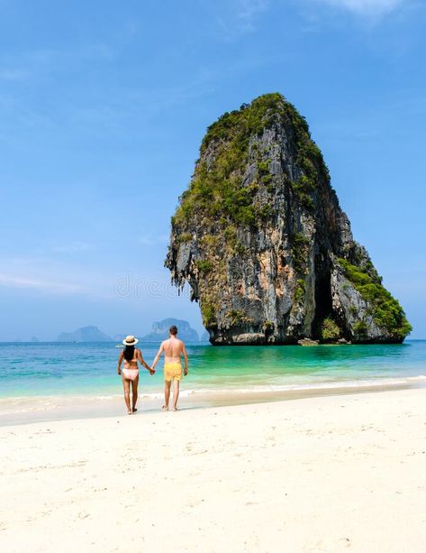 Couple of men and woman relaxing on the beach during vacation in Thailand Railay Beach Krabi stock photography Railay Beach Thailand, Railay Beach Krabi, Women Relaxing, Relaxing On The Beach, Woman Relaxing, Railay Beach, Bird Tattoos, Krabi, Beach Vacation