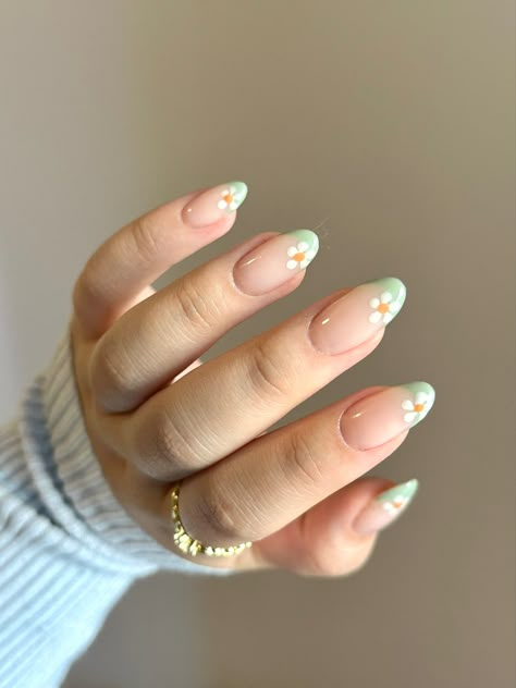 Spring Nails With French Tips, Green Flower Almond Nails, Light Sage Green French Tip Nails, Mint Green Daisy Nails, White French Tip With Daisy, Green French Nails With Flowers, Pink Nails With Green Flowers, Simple French Nails Color, Green French Tip Nails With Flowers