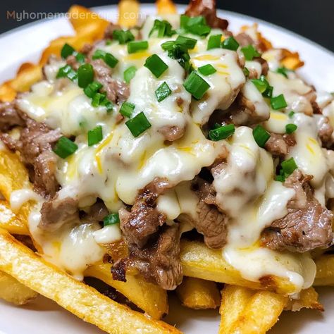 Philly Cheesesteak Fries are an indulgent snack made with crispy fries, tender shaved steak, and a deliciously creamy cheese sauce. A quick and flavorful dish perfect for sharing! Philly Cheesesteak Fries, Cheesesteak Fries, Melted Cheese Sauce, Shaved Steak, Farmhouse Recipes, Steak Chili, Crispy Fries, Homemade Cheese Sauce, Chili Cheese Fries