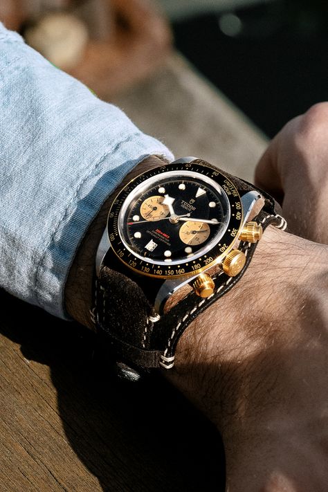 In the spirit of 1970s racing, the Black Bay Chrono offers a bund-type strap option in aged brown leather with ecru stitching and a folding clasp. Tudor Watch, Tudor Black Bay, All Blacks, The Tudor, Brown Leather Strap, Mens Style, Breitling Watch, Rolex Watches, Rolex