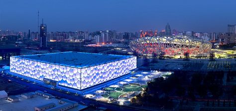 One of the most memorable pieces of architecture at the Beijing Olympic Games four years ago.  Now the iconic blue 'bubble-wrap' building, known as The Cube, has been transformed from a 50m Olympic pool with spectator stands into a fantasy water-world open to the public      Read more: http://www.dailymail.co.uk/news/article-2183785/Beijings-aquatic-centre-The-Cube-transformed-multi-coloured-water-world-high-speed-rides-floating-jellyfish. Beijing National Stadium, Architecture Cool, Indoor Waterpark, Sports Stadium, Norman Foster, National Stadium, Calgary Flames, Camp Nou, Unique Venues