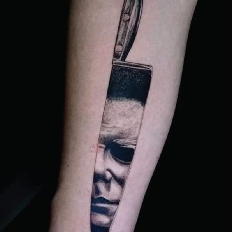 Black & Grey Michael Myers Knife Portrait Horror Tattoo Idea & Design on Arm Michael Myers Knife Portrait Horror Tattoo Done At Mike Myers Tattoo, Michael Myers Tattoo Simple, Michael Myers Hand Tattoo, Micheal Myers Knife Tattoo, Micheal Myers’s Tattoo, Michael Myers Tattoo, Michael Myers Portrait Tattoo, Knife Tattoo, Diamond Tattoos