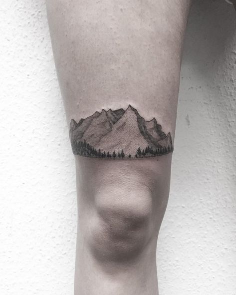 Incredibly detailed, dot-work style mountains and trees tattoo inked above the right knee Watercolor Mountains Tattoo, Small Mountain Tattoo, Trees Tattoo, Mountain Tattoos, Tattoo On Thigh, Mountain Tattoo Design, Related Tattoos, Mountains And Trees, Geometric Mountain