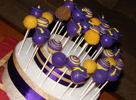 Purple and Gold Graduation Cake Pops - cake pops for a friends son's graduation party.  used his school colors. Purple And Gold Graduation Cake, Purple And Gold Cake, Gold Cake Pops, Graduation Cake Pops, Cake Pop Displays, Graduation Food, Pops Cake, Gold Graduation Party, Senior Graduation Party