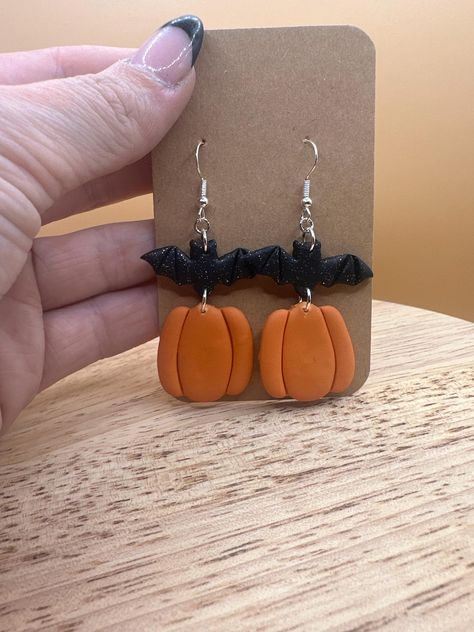 Handmade polymer clay bat and pumpkin earrings made recently by me. These earrings are simple but perfect the the spooky season! Each pair is 2.5" long. Every pair is carefully packaged and shipped to you.  *SOCIALS* Instagram - felicitys_creative_creations Pumpkin Earrings, Handmade Polymer Clay, Bat, Polymer Clay, Jewelry Earrings Dangle, Etsy Earrings, Dangle Drop Earrings, Dangle Earrings, Jewelry Earrings