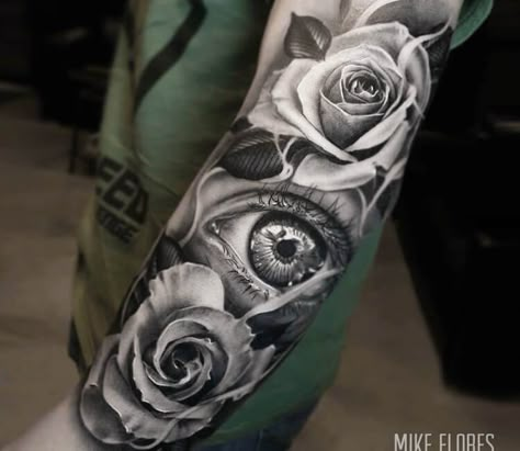 Photo - Roses and Eye, awesome black and grey realistic tattoo artwork done by tattoo artist Mike Flores | Large Tattoo Photo 27849 | World Tattoo Gallery 3rd Eye Tattoo Women, 3rd Eye Tattoo, Ojo Tattoo, Realistic Eye Tattoo, Third Eye Tattoos, Mangas Tattoo, Rose Tattoo Sleeve, Black Rose Tattoos, Forarm Tattoos