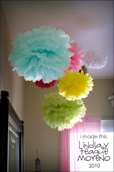 Tissue paper pom poms hanging from ceiling create a whimsical effect Classroom Hanging Decorations, Classroom Hanging Decorations Ceilings, Diy Playroom, Tissue Pom Poms, College Living, Tissue Paper Pom Poms, Paper Pom Poms, Party Deco, Playroom Organization