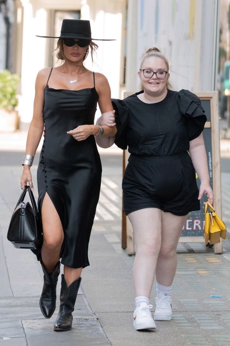 Towie’s Chloe Sims poses with rarely-seen daughter Madison, 16, as they go out arm-in-arm in London’s West End Louis Vuitton Cake, Spaghetti Strap Gown, Sims Poses, Chloe Sims, Puff Sleeves Dress, Black Gown, West End, Wide Brimmed Hats, Go Out