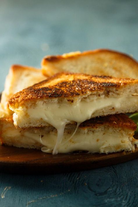 The most comforting foods are often the ones we devoured during childhood. And what could bring that pang of nostalgia more than grilled cheese? This decadent grilled cheese recipe elevates a classic dish by using fontina cheese, which melts perfectly in the sandwich. Easy Recipes for Perfect Home-Cooked MealsThe reason this dish is so incredible? It used to be a popular menu item at Panera Bread. The since-discontinued sandwich used four different types of cheese, including fontina. And now you Fontina Grilled Cheese, Healthy Grilled Cheese, Crispy Grilled Cheese, Gourmet Grill, Gourmet Grilled Cheese Sandwich, Panera Recipes, Gourmet Grilled Cheese, Gourmet Grilling, Fontina Cheese