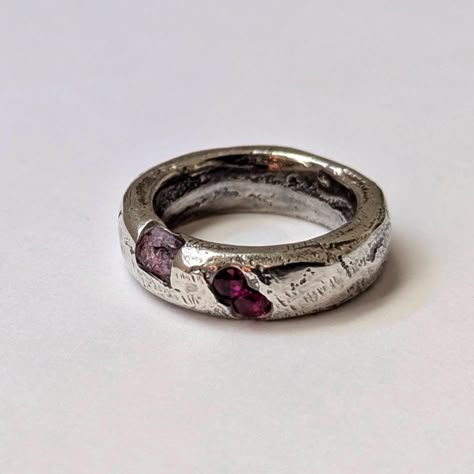 Sandcast ring  in sterling silver with raw ruby and lab grown ruby stones. Gorgeous solid silver domed band with organic texture left by the sand and flow of the molten silver. Treat yourself or gift to someone special. This ring makes a perfect engagement or anniversary gift. These rings are very durable making them great for everyday wear.  Size AU L, US 6,  EU 51.2 Unisex design. These rings are cast in sand as one solid piece with melted fine silver and sterling silver. The casting is made f Sand Casted Jewelry, Edgy Wedding Rings, Casted Rings, Unique Silver Engagement Rings, Sandcast Ring, Silver Clay Ring, Engagement And Wedding Ring Sets, Organic Engagement Rings, Ancient Rings