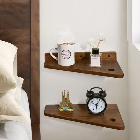 PRICES MAY VARY. Simple Design - The floating nightstand is made of beautiful walnut color, with a trapezoidal design, and the outer corners are rounded to prevent children from being hurt. You can have more space to rearrange your things, or use it as a minimalist bedside table where you can put a small lamp, phone, bottle of water, etc. Versatile Storage and Display Wall Shelf —Simple and practical, unique appearance, can be used as a floating shelf, plant shelf, desk, nightstand, side table,